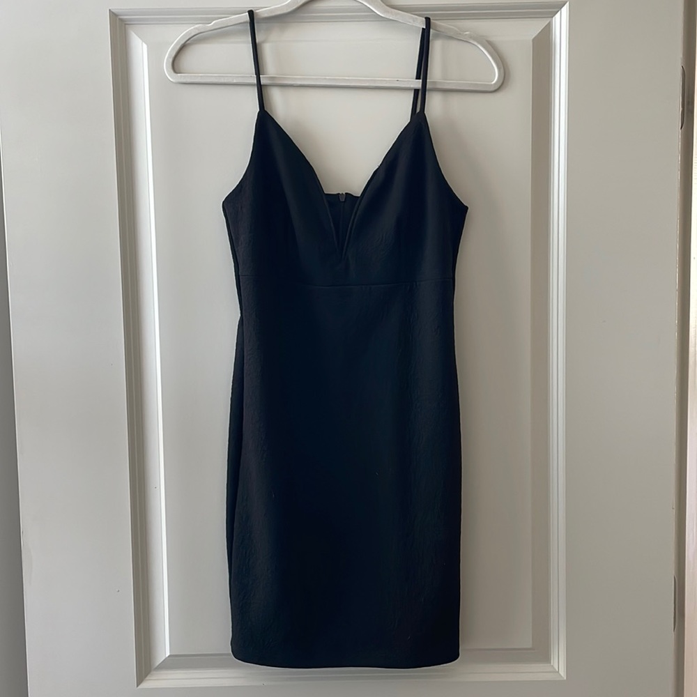 Deep plunge little Black fitted spaghetti strap dress